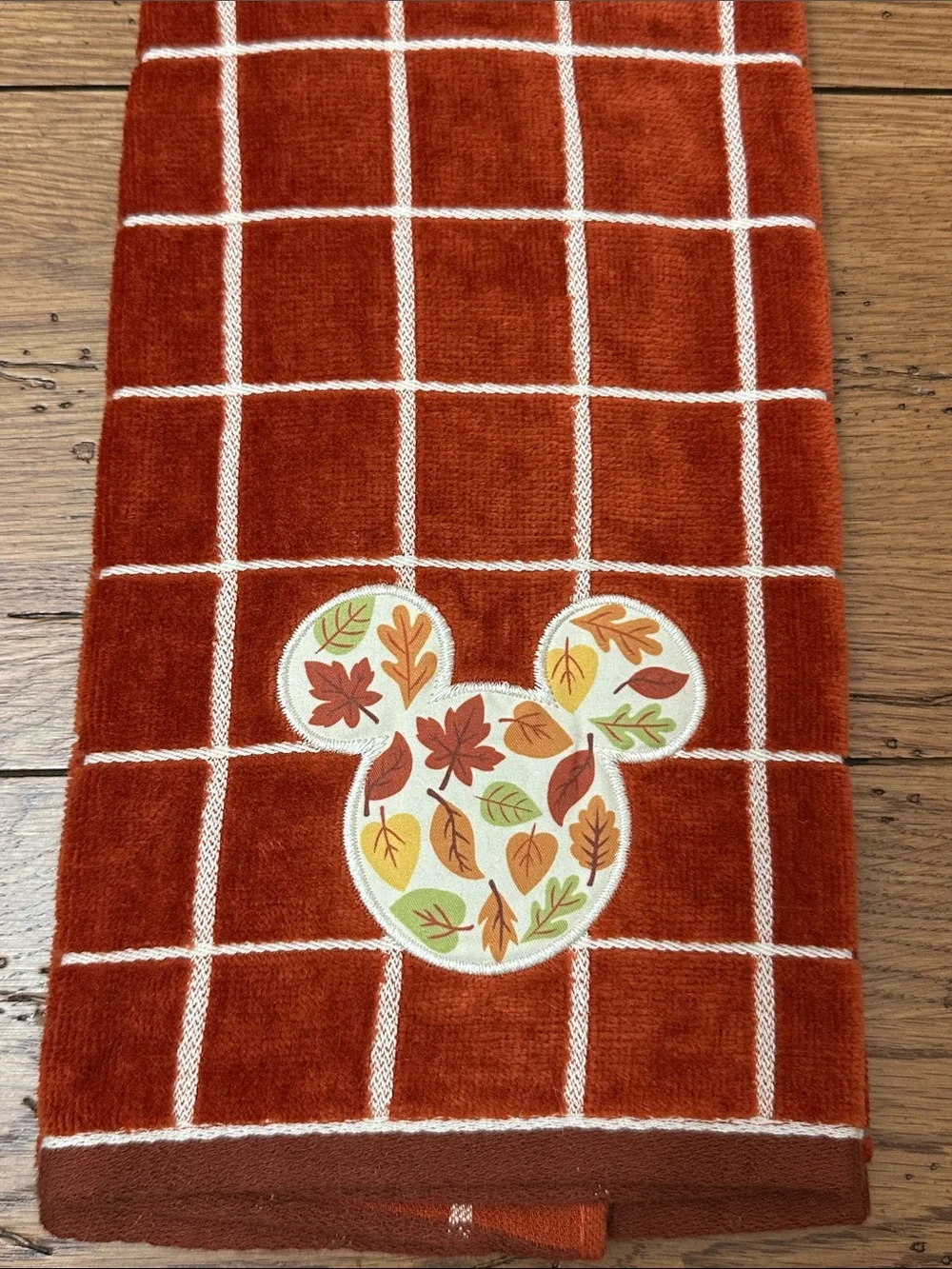 Disney Rust Orange Grid Hand Towel with Leaf Mickey Patch